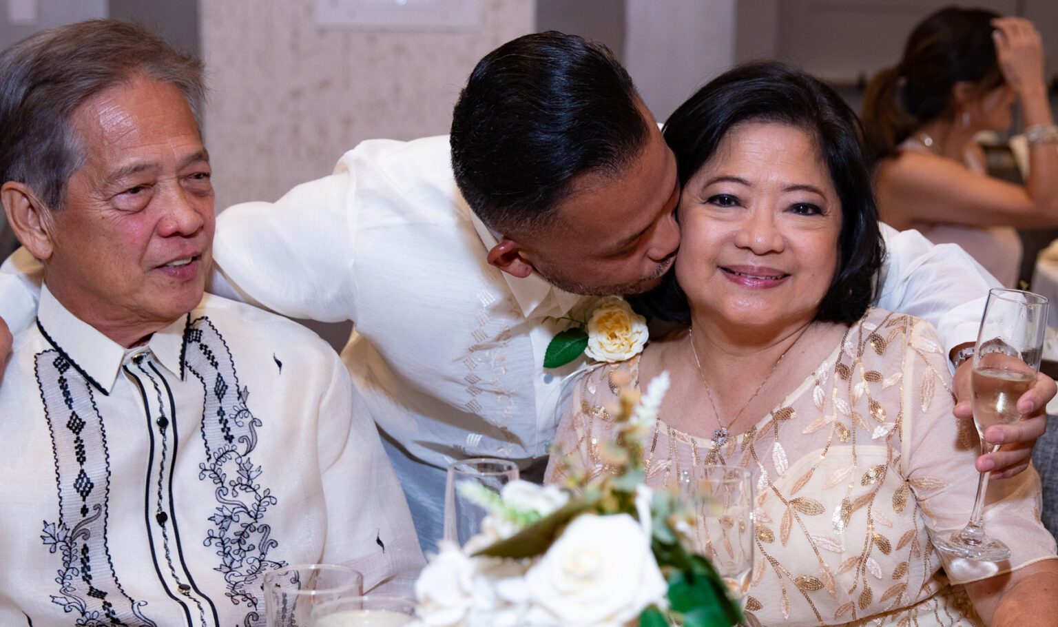 child kissing mother’s cheek