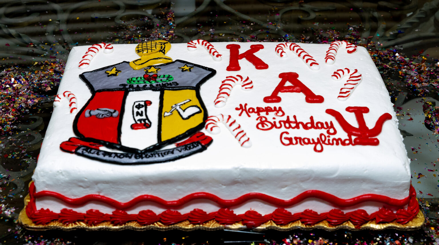 A cake with the name of kay and birthday on it.