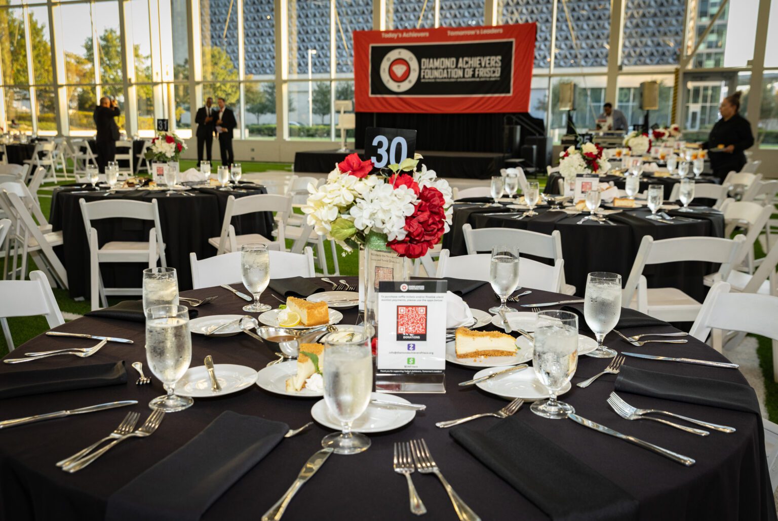 A table set up with black and white plates